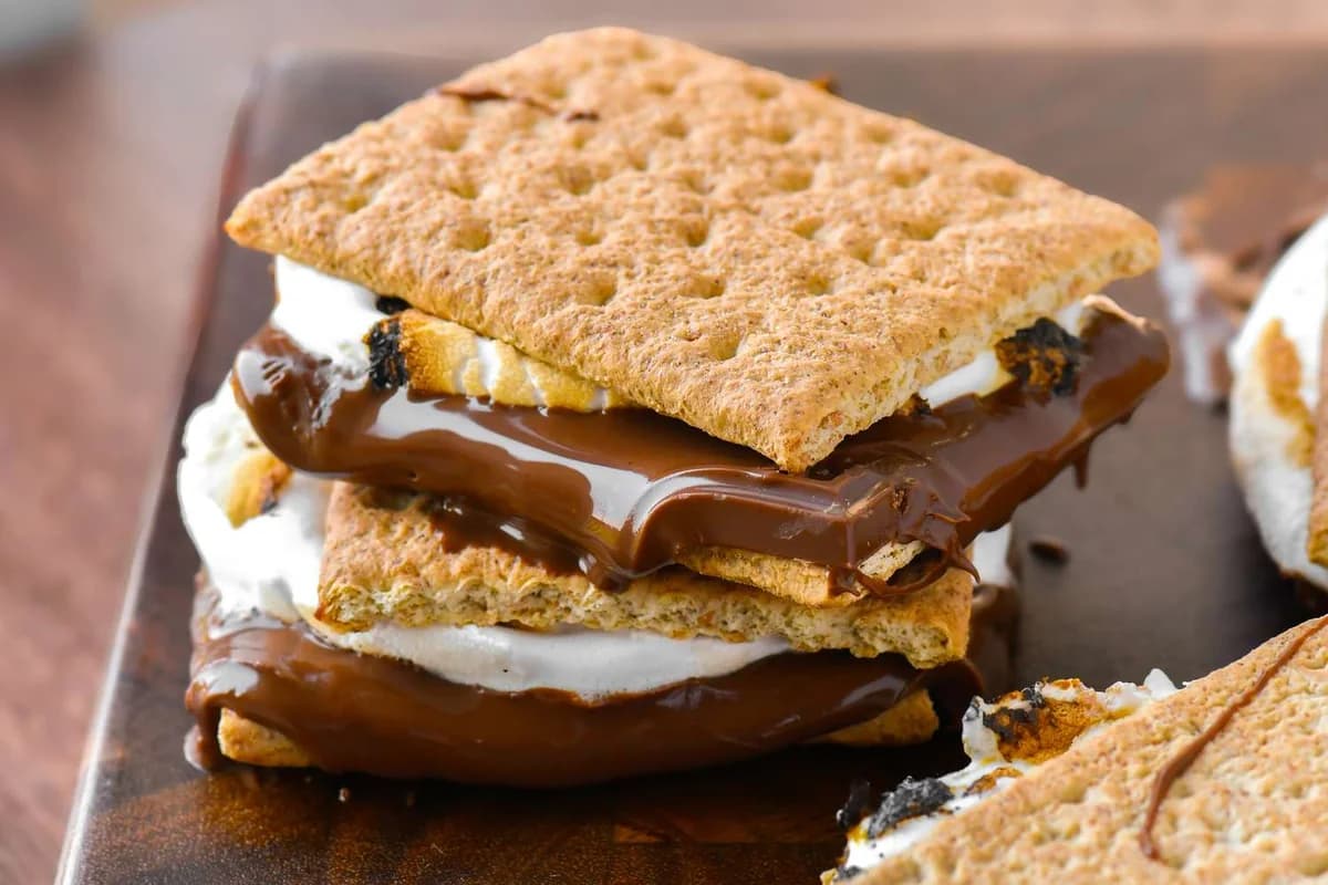 National S'mores Day - Gather 'round the campfire for National S'mores Day! This quintessential American treat combines graham crackers, chocolate, and marshmallows into pure nostalgic bliss. Celebrate summer traditions and outdoor memories with this beloved camping classic.